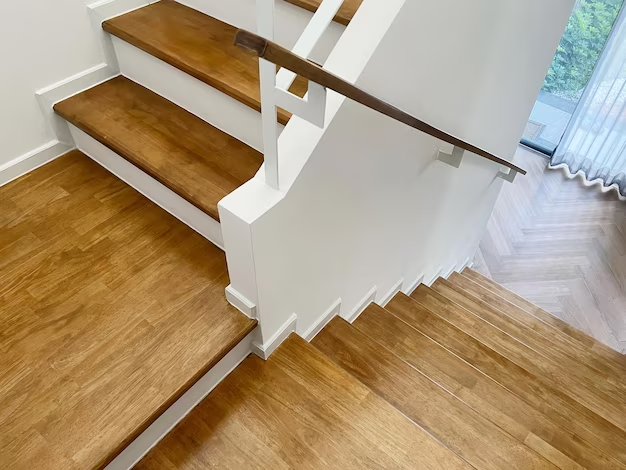 A beautiful landing vinyl plank stairs in a house.