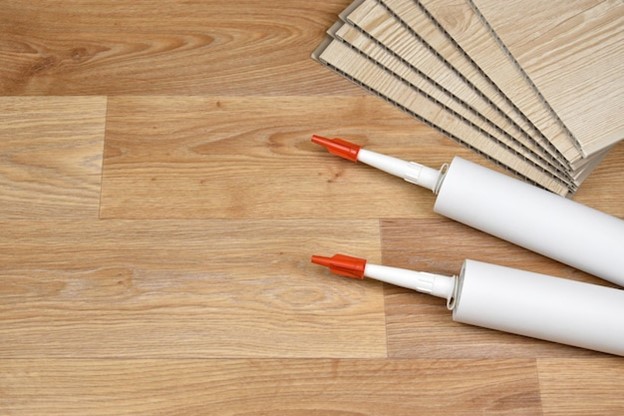 A floor glue pump with vinyl planks.