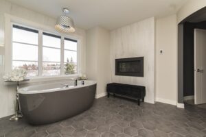 A vinyl flooring bathroom with black hexagon-shaped tiles.